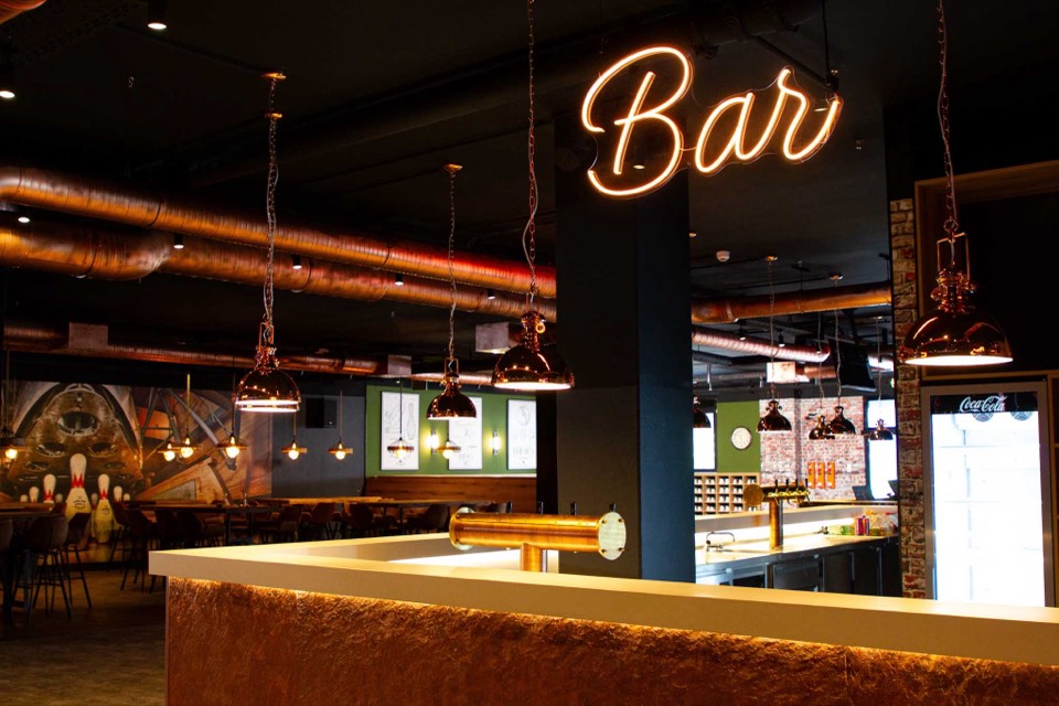 Bar, lounge & neon signs for Friday's Bowling